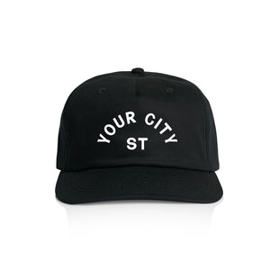 Customizable black cap with 'YOUR CITY STATE' text on a white background