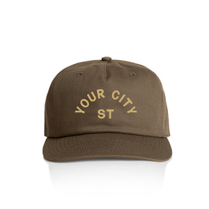 Customizable brown cap with 'YOUR CITY STATE' yellow text on a white background