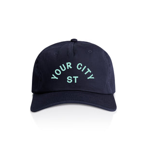 Customizable navy blue cap with 'YOUR CITY STATE' text on a white background