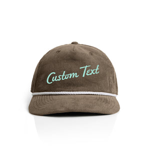 brown corduroy cap with 'Custom Text' in seaglass on a white background